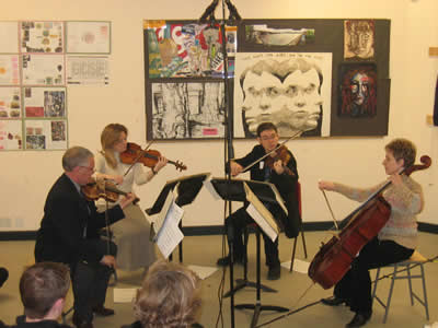 An image of the Callish Quartet performing as part of one of their workshops